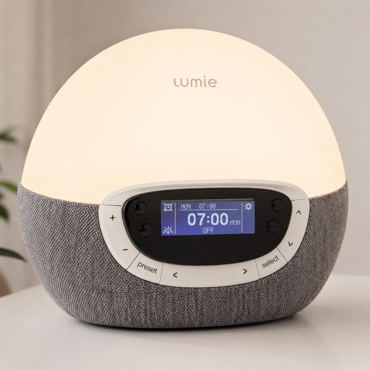 Lumie Bodyclock Rise300 modern alarm clock on a bedside table Lumie Bodyclock Rise300 modern alarm clock on a bedside table